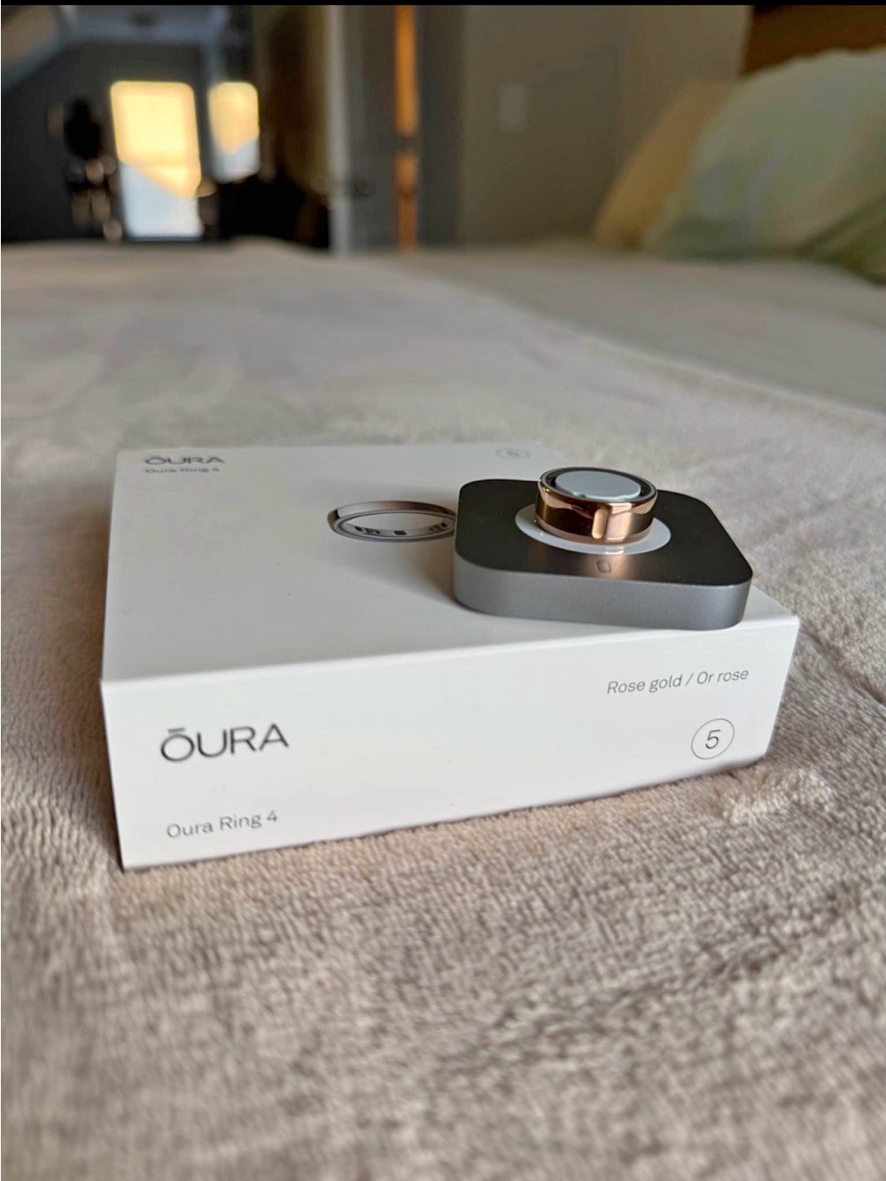 Oura Rose Gold Ring 4 with Silver Charging Dock